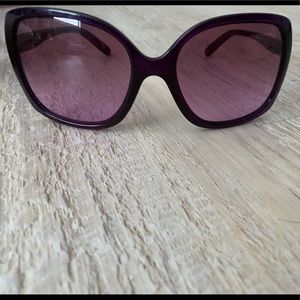 Purple Oakley sunglasses with purple lenses